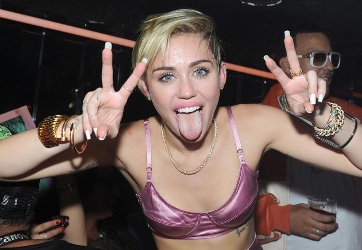 Miley Cyrus enjoying a cheeky game of beer pong whilst on tour!